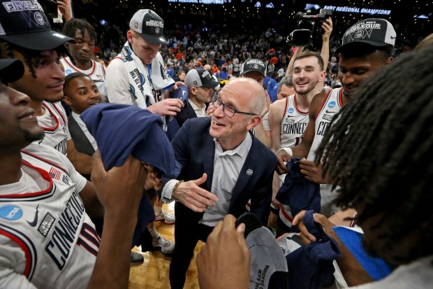 UConn head coach Dan Hurley celebrates with his team after the Huskies won the regional title with a 77-52 victory over Illinois in Boston. (Staff Photo/Stuart Cahill/Boston Herald)
