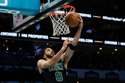 Boston Celtics forward Jayson Tatum (0) shoots against the Charlotte Hornets during the second half of an NBA basketball game in Charlotte, N.C., Monday, April 1, 2024. (AP Photo/Nell Redmond)