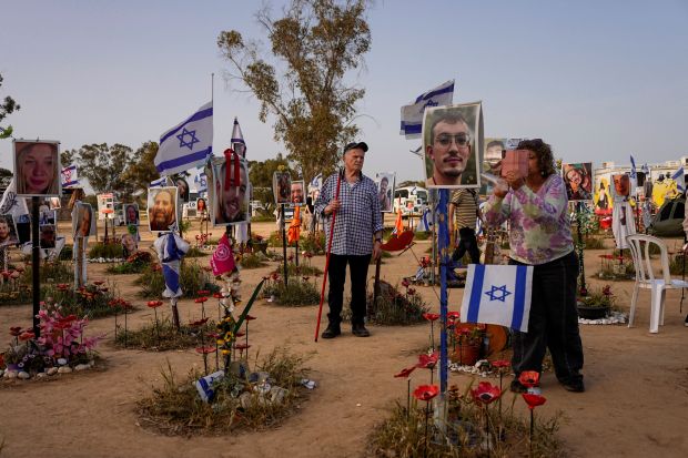 People visit the site where revelers were killed and kidnapped on Oct. 7 cross-border attack by Hamas militants at the Nova music festival near Kibbutz Reim, southern Israel, Wednesday, March 27, 2024. (AP Photo/Ohad Zwigenberg)