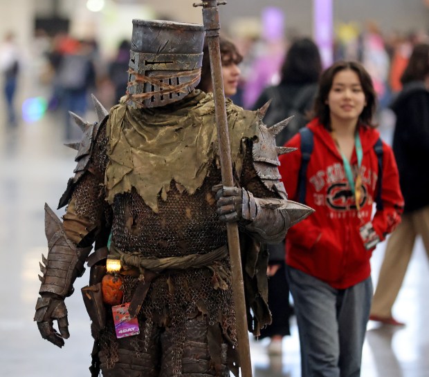 A costumed character walks though the convention floor during PAX East at the BCEC. (Matt Stone/Boston Herald)
