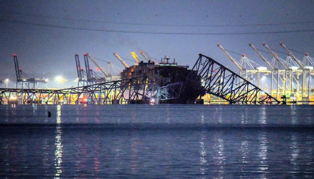 The Francis Scott Key Bridge in Baltimore collapsed overnight after being struck by a ship in the early morning of Tuesday, March 26. (Karl Merton Ferron/Staff)