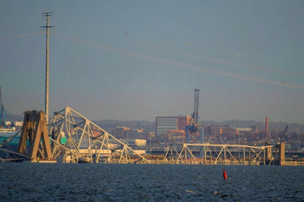 Baltimore's Francis Scott Key Bridge collapsed early Tuesday morning after a support column was struck by a vessel. (Karl Merton Ferron/Staff)