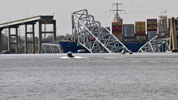The Francis Scott Key Bridge collapsed into the Patapsco River early Tuesday morning after a container ship struck a support column. First responders are searching for six construction workers who were filling potholes on the bridge. Two were rescued. (Kim Hairston/Staff)