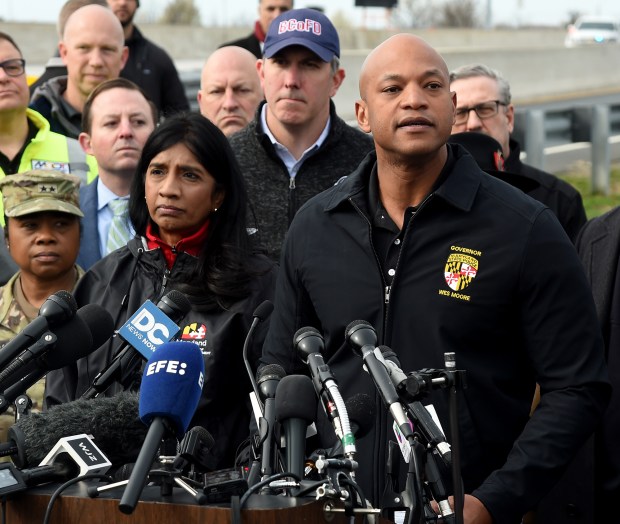 Governor Wes Moore speaks at a news conference at the Maryland Department of Transportation campus near the bridge. Lt. Governor Aruna Miller is on left; Baltimore County Executive Johnny Olszewski is behind them, as well as Senate President Bill Ferguson. (Barbara Haddock Taylor/Staff)